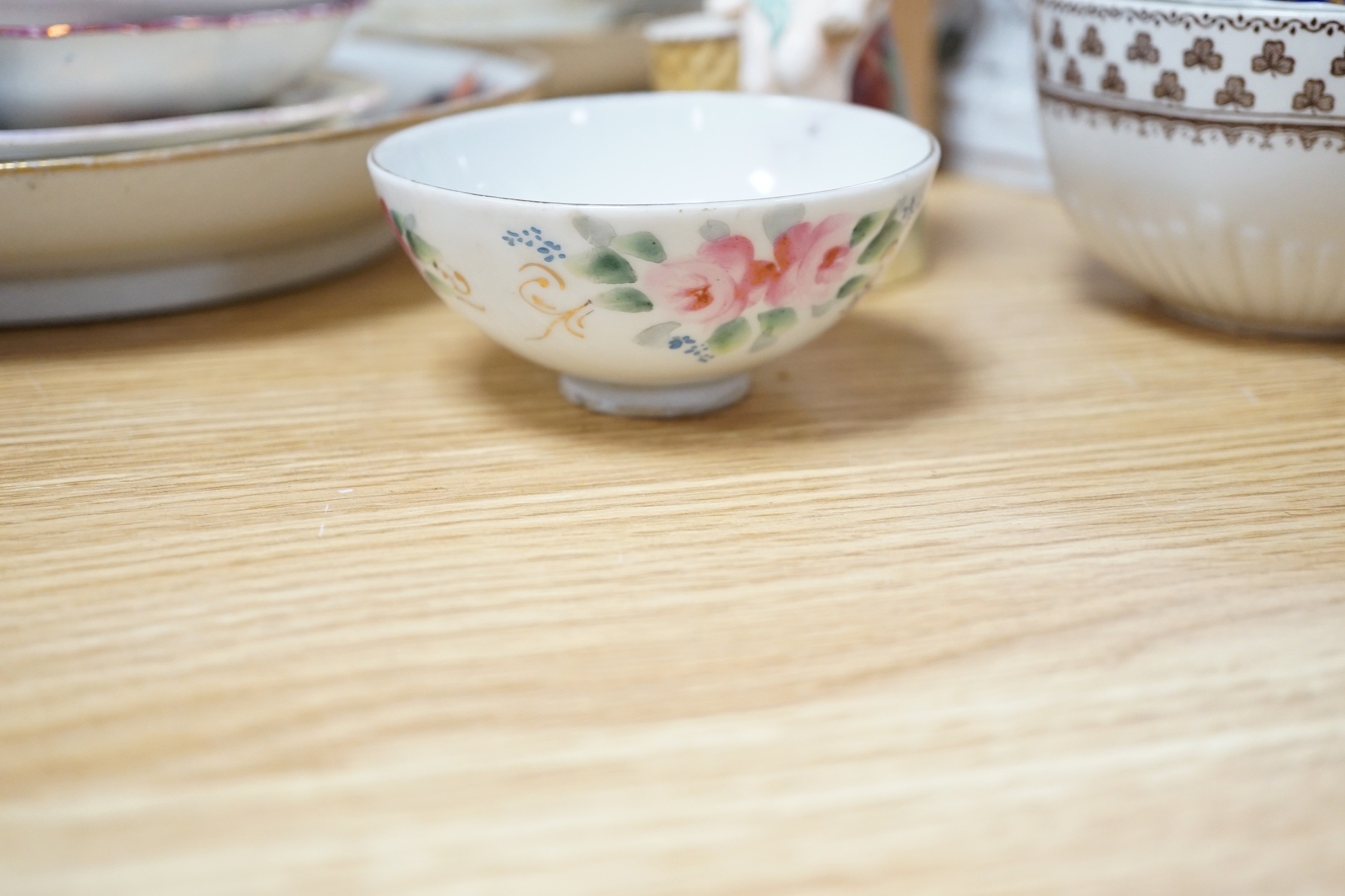 A large collection of mixed 19th century tea ware, a Staffordshire flat back, floral encrusted vase
